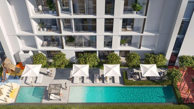 Evergr1n House 4 swimming pool and landscaped deck below the residential facade.